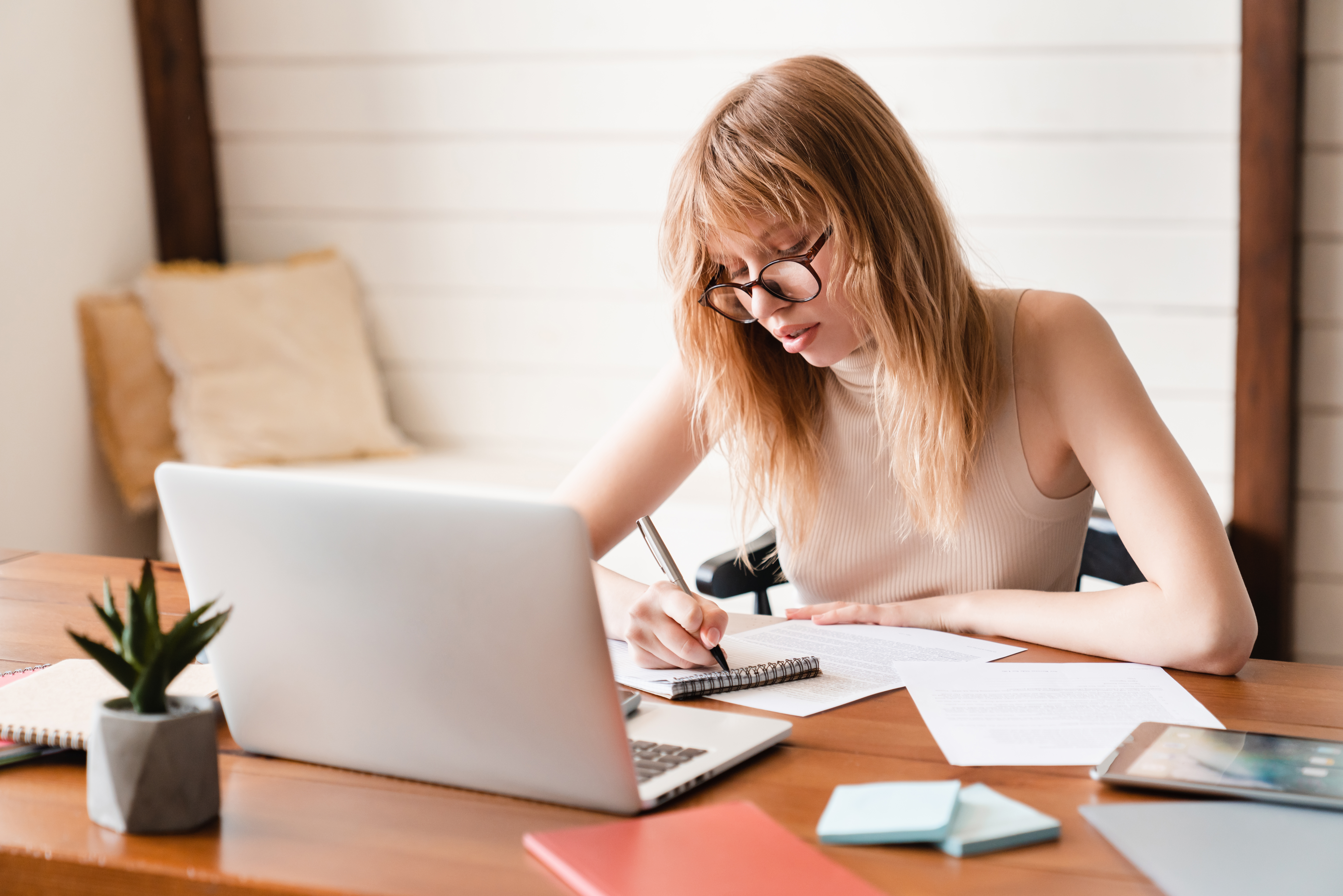 E-learning, webinars, college homework concept. Businesswoman tutor using laptop remotely